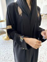 ⁦عبايه بأكمام جلد لون اسود⁩ - الصورة ⁦9⁩