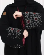 ⁦عباية أجوان بشك عنابي على اكمام⁩ - الصورة ⁦2⁩